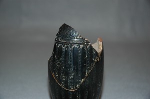 Close up showing detail WHAT DETAIL on black-glazed lekythos base.